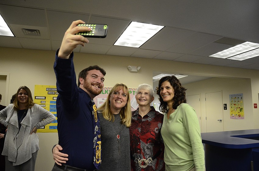 Ian Ackroyd, Venice Middle School band teacher, takes a selfie with Lisa Figueroa, Caroline Zucker and Gina Barresi.