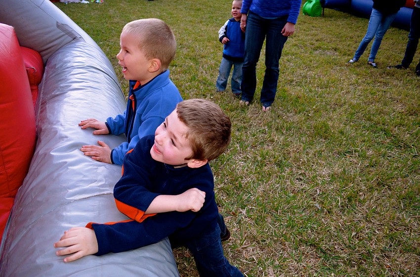 Parker Solie and Prescott Bell compete to score the most number of baskets.