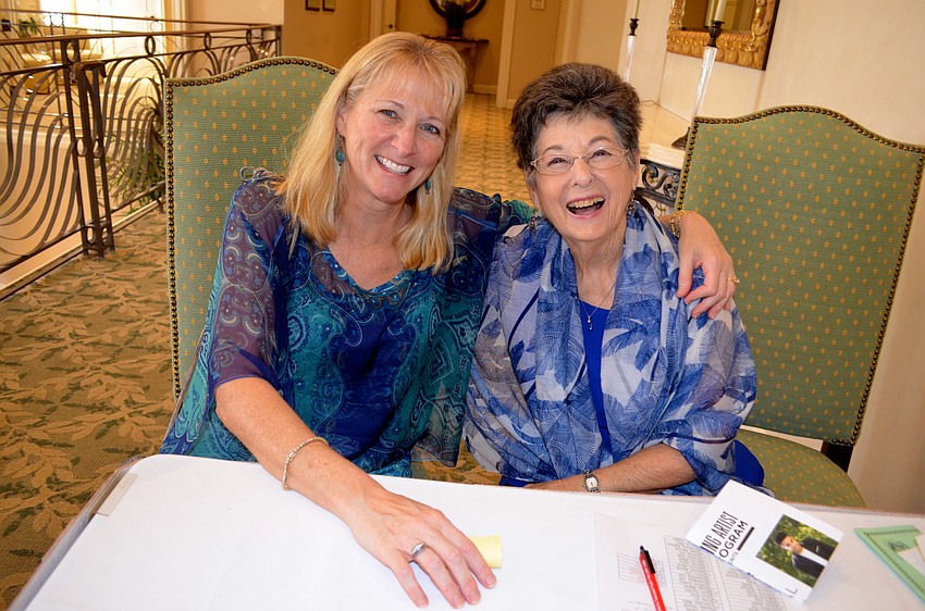 Kala Sheckler and Judi Sterne greet attendees at the door.