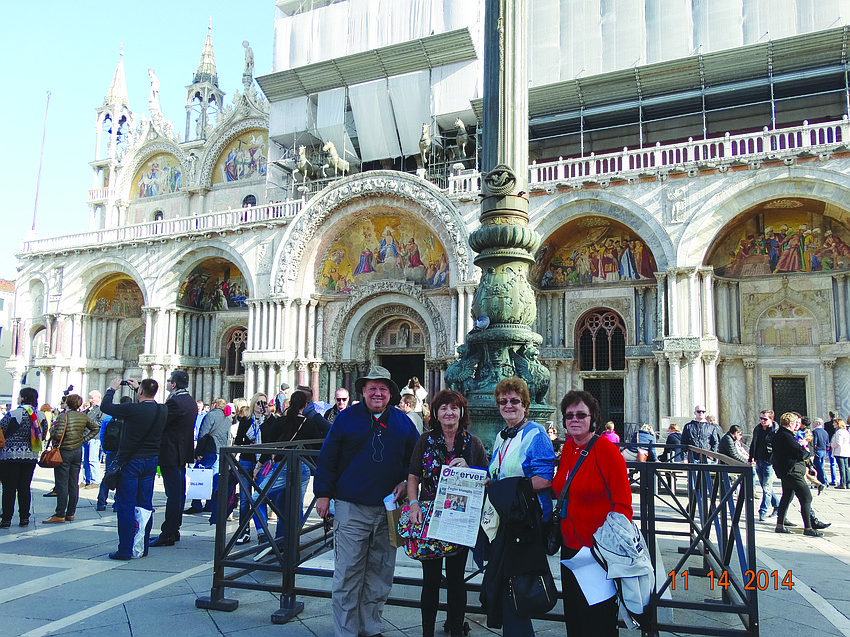 ITALIAN ADVENTURE. Larry and Sandy Simmons, Carol Bartens and Donna Bartens, shared their Observer with others while touring St. Mark's Plaza in Venice, Italy.