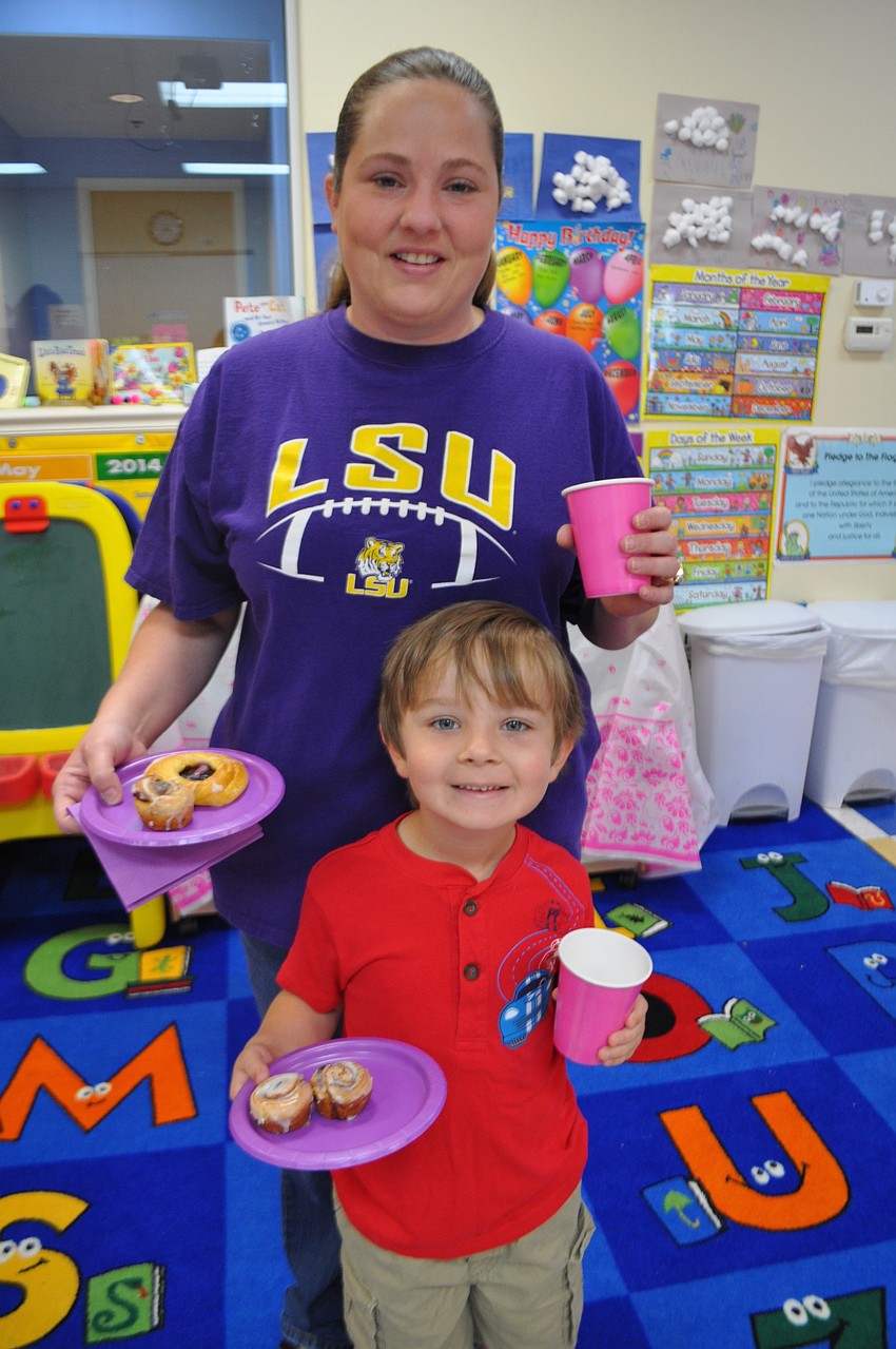 Brooke Temple and her son, Andrew, 5, feast on miniature cinnamon rolls.