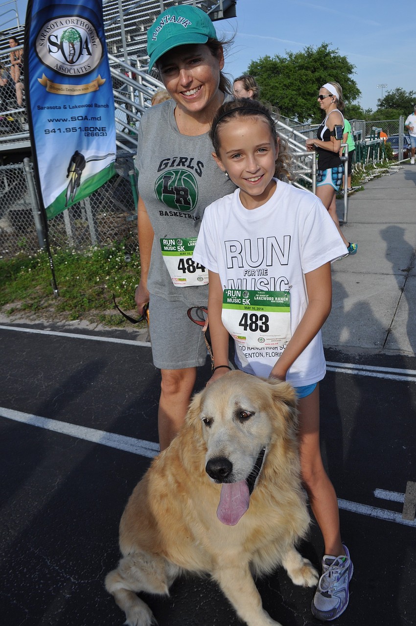 Karrin and Megan Scully, with Komet, prepare for the 1-mile walk.