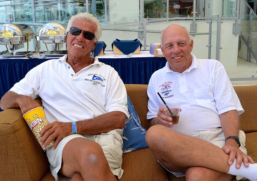 Bob Baime and Blair McCracken relax at the pool party after racing in the regatta.