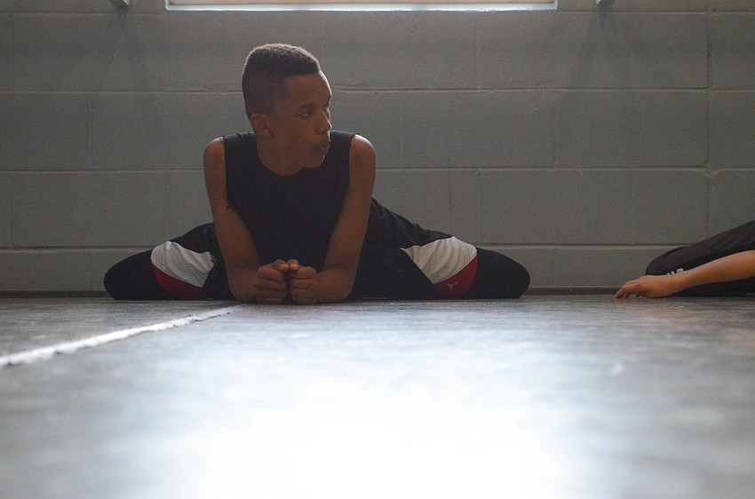 Shemar McCloud stretches before a â€œPeter Panâ€ rehearsal