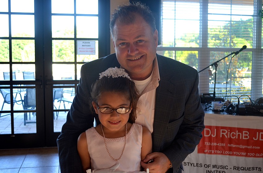 Makenna Elliott smiles beside her father, Tom.