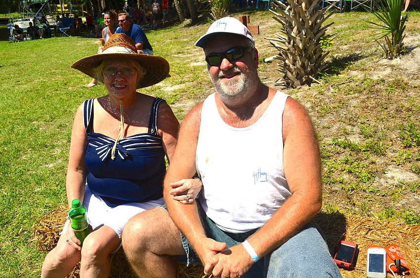 Inger and Rob Taylor hide their faces from the sun.
