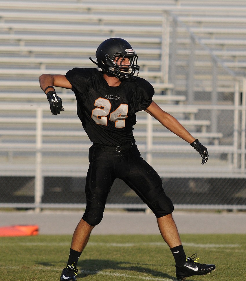 Sarasota junior Julius Gonzalez celebrates after making a tackle in the first half.