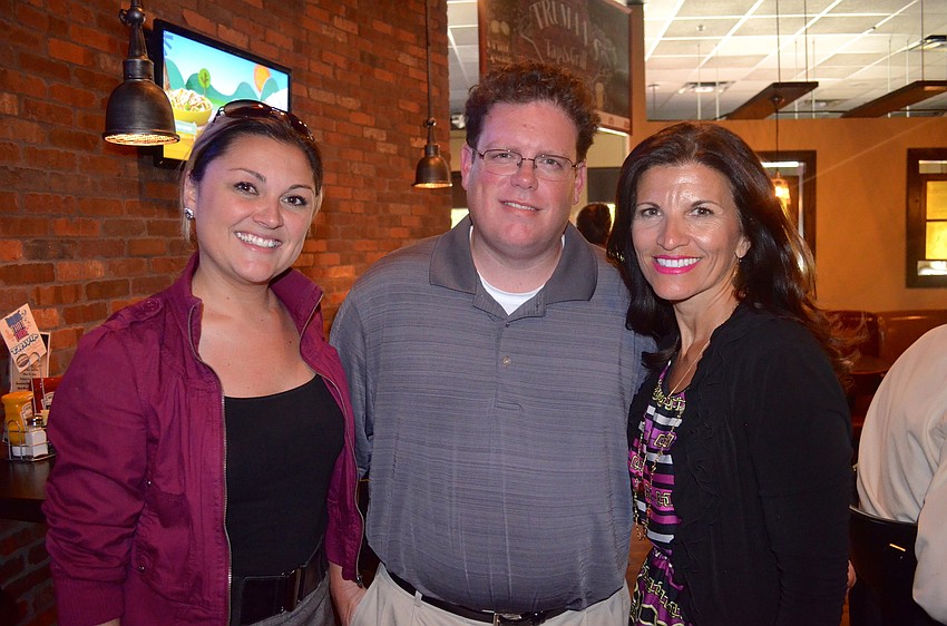 Melissa Ingrisano, David Mercier and Violeta Huesman network with new friends.