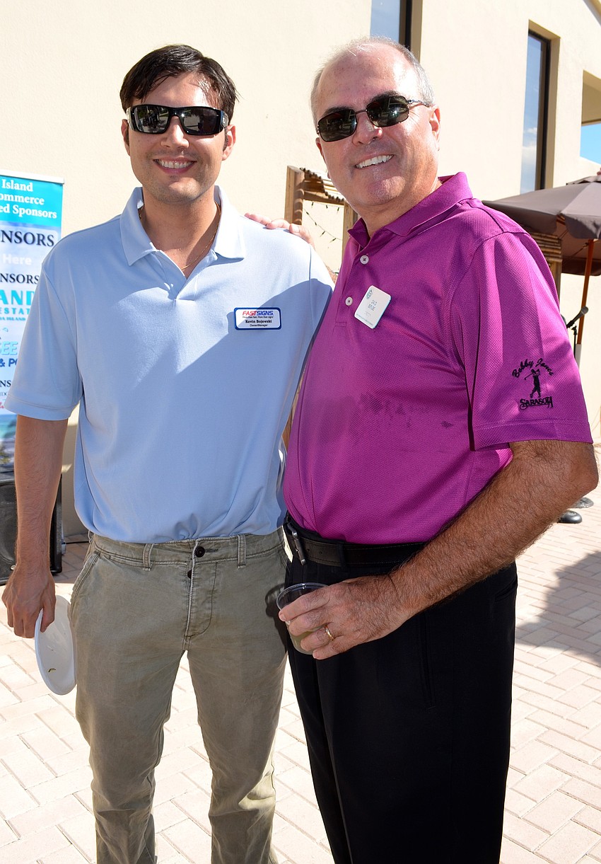 Kevin Bojewski, FastSigns, and David Berube, Anna Maria Chamber of Commerce Board of Directors