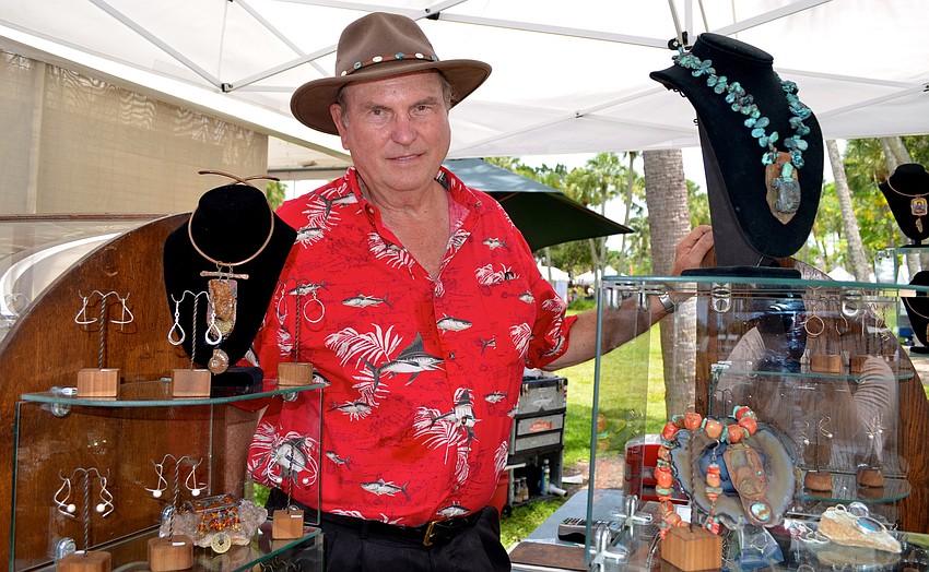 Terry Bodeker prepares to assist customers at his handcrafted jewelry booth.