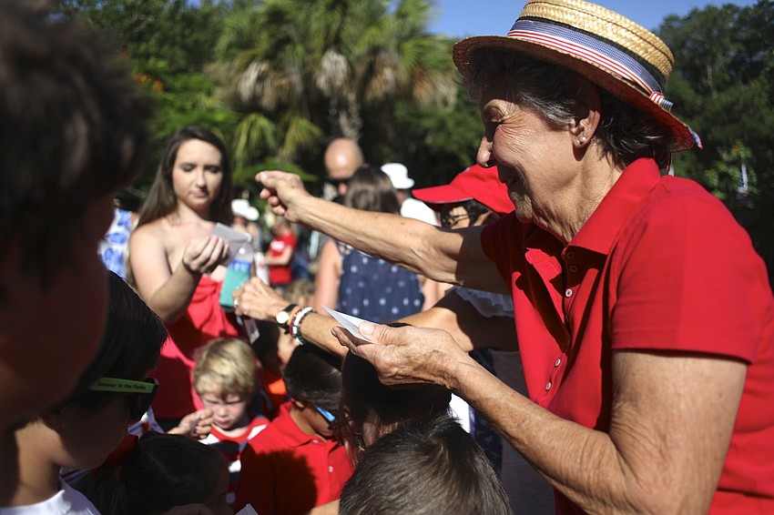 Jane Boehme hands out butterflies before the release.