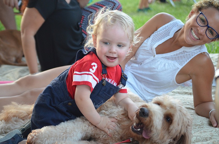Greyson Giguere plays with Turbo and Angelica Shell.