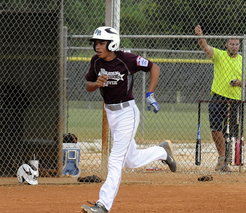 Kaleb Quinones heads for home plate after hitting a home run for the Braden River Intermediate All-Stars during their district championship victory over Manatee West.