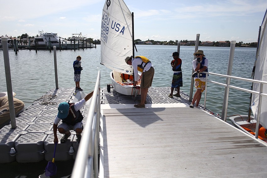 Campers wait on the floating dock before they begin their morning excursion.