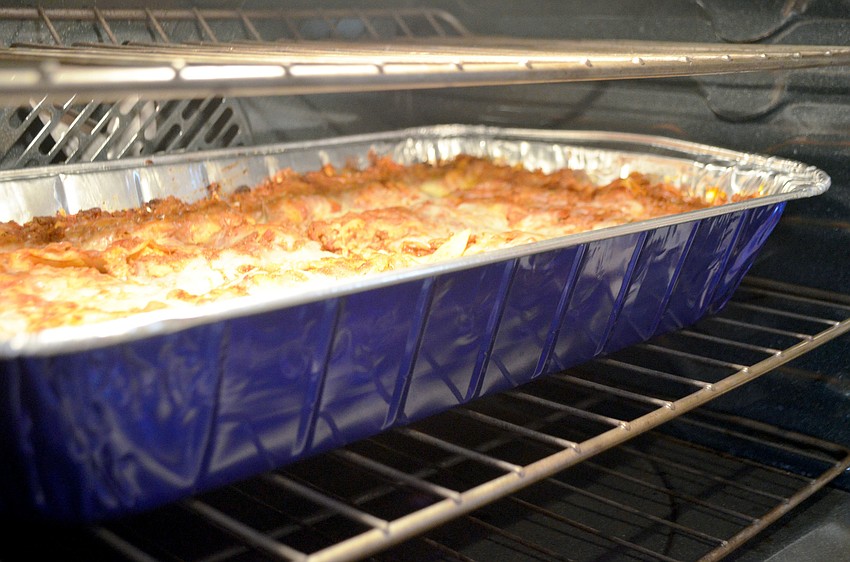 Christ Churchâ€™s summer dinner hosts brought homemade Italian entrees, such as both meat and cheese lasagnas, for the annual feast.