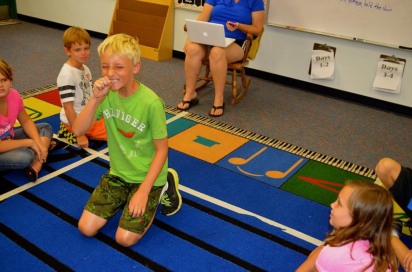 Hunter Smith acts out a phrase during Charades.
