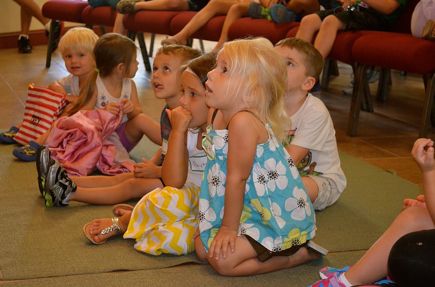 Mabel Clausen listens intently to songs.