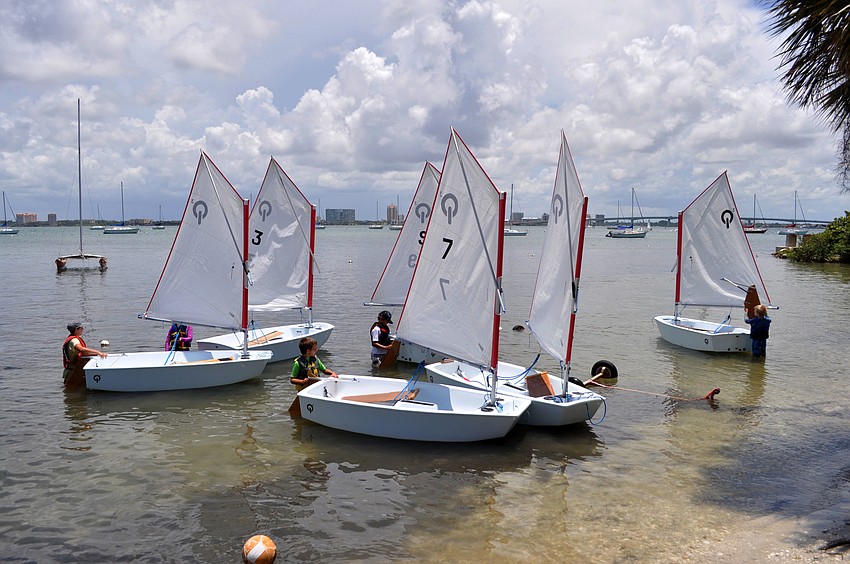 SYSP summer sailing camp students prep their optiâ€™s for sailing.