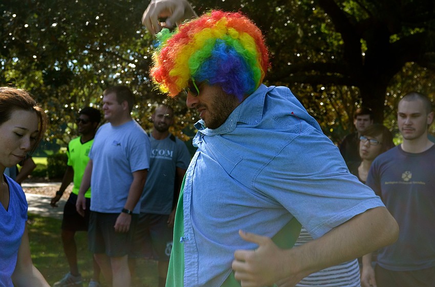 Mark Frangione quickly changes into a clown costume for the clown relay event.