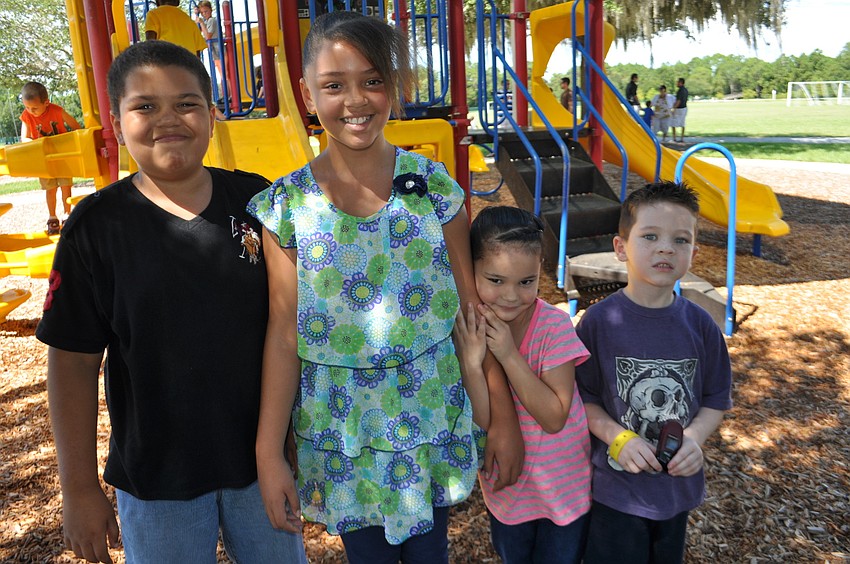 Cameron and Kylie Yowe meet up with Jasmine and Jose Velez on the playground.