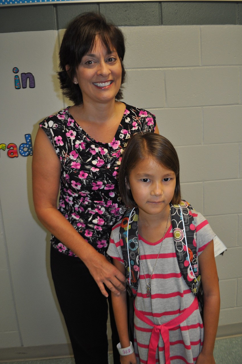 Ann and Emma Chapman prepare to take Ann to her second-grade classroom.