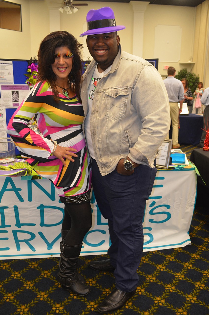 Edison Senat and Gina Spicer-Gentiluomo from Manatee Children's Services dress up.