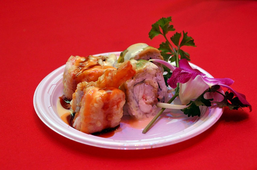 Tsunami prepared its Waikiki Roll and its Tsunami Roll at A Taste of Downtown.