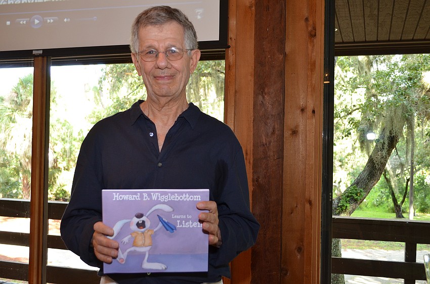 Binkow displays the cover to his title â€œHoward B. Wigglebottom Learns to Listen.â€