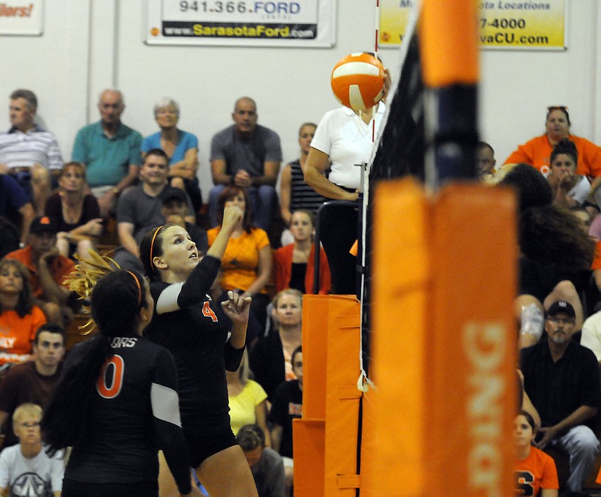 Sarasota senior captain Toni Mogensen hits the ball back over the net in the first set.