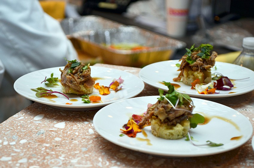 Braised lamb on bread pudding with brandy sauce and cilantro