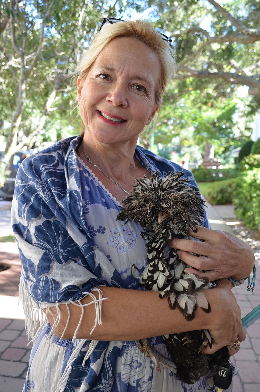 Wendy Fitzgerald brought her four-month-old Polish Bantam hen, Elvis to be blessed.