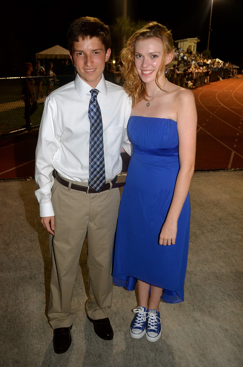 Freshmen prince and princess Cole Chalhub and Julia King wait for their chance to walk across the field.