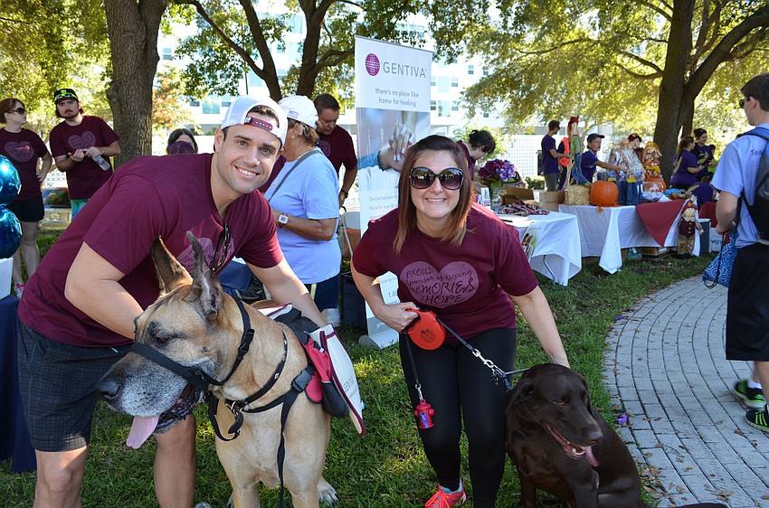 Brad Dees and Brittney Ellis attend the walk for team Gentiva with their furry friends Cayden and Cooper.