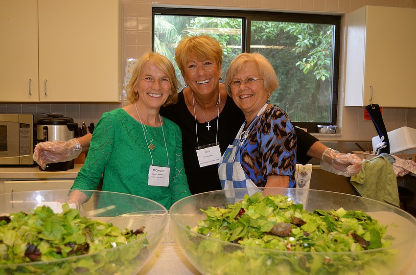 Michaele McKenna, Beth Waldman and Carol Fischbein make the salad for lunch.