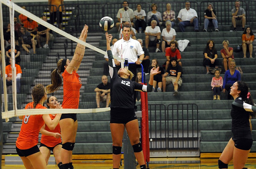 Lakewood Ranch setter Courtney Rapp records a point for the Lady Mustangs.