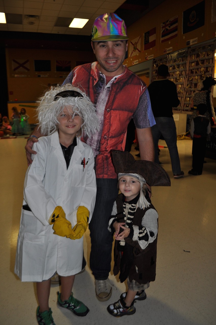 Bronson, Aaron and Oliver Empsall head toward the dance floor.