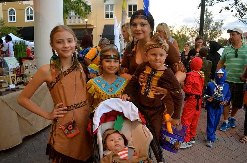 The Mirnyi family â€” Melanie, Betra, Ksenia, Demid and Trophym â€” dress as Indian Americans.