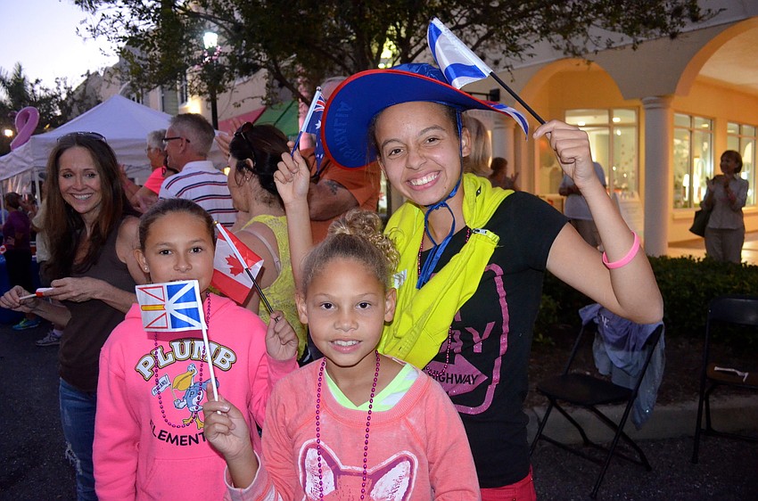 Shae, Kai and Bryn Armstead show support for the parade participants.