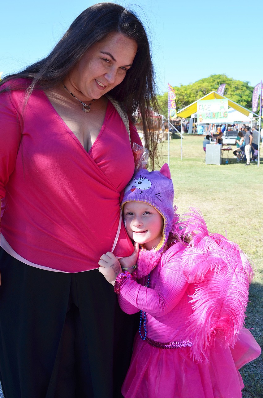 Erica Ochs and her daughter Fallyn attend the Sarasota Pumpkin Festival.