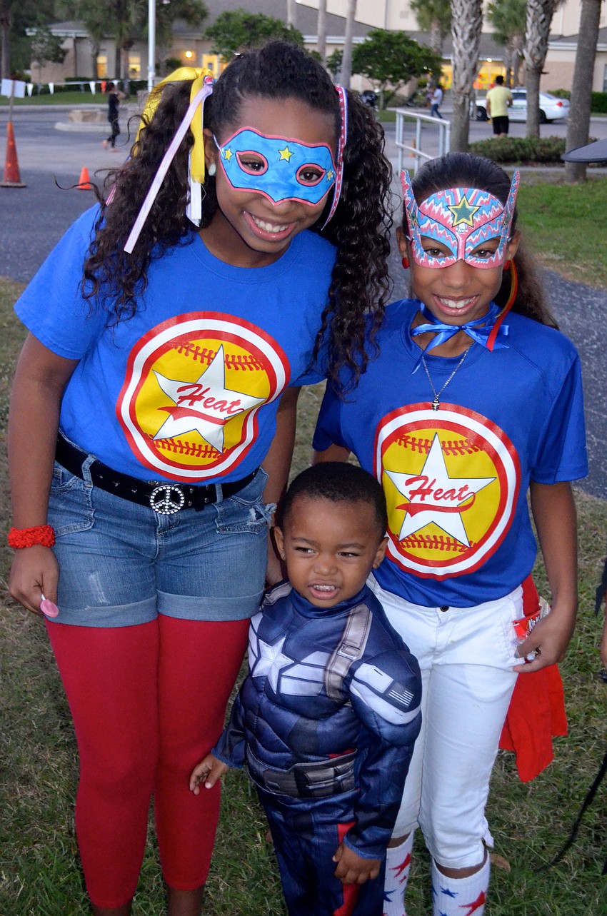 Siblings Solenia, Taic and Alexander Caminero enjoy dressing up in costumes.