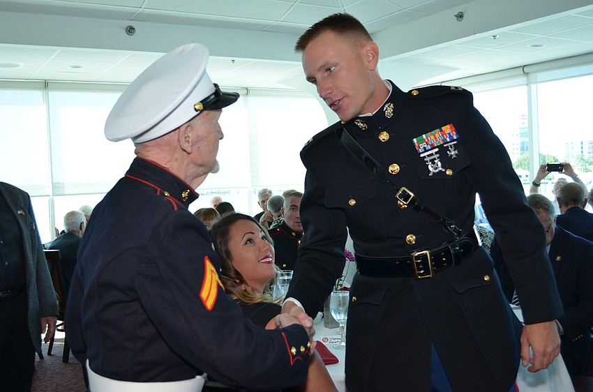 Veteran Larry Larose and Capt. Geoff Smith met during the birthday luncheon.