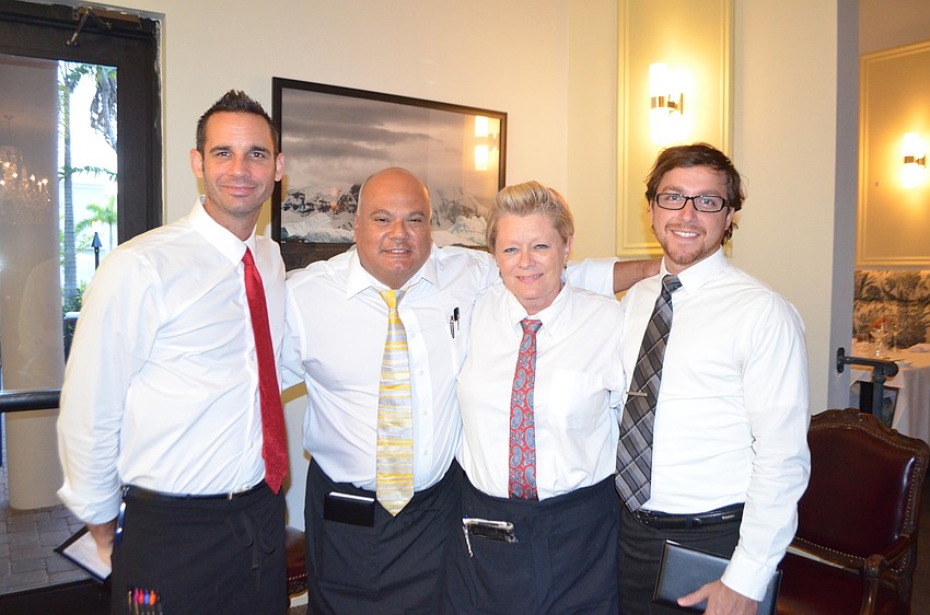Servers Greg Dixon, George Arata, Colleen Lonergan and Alex Dixon