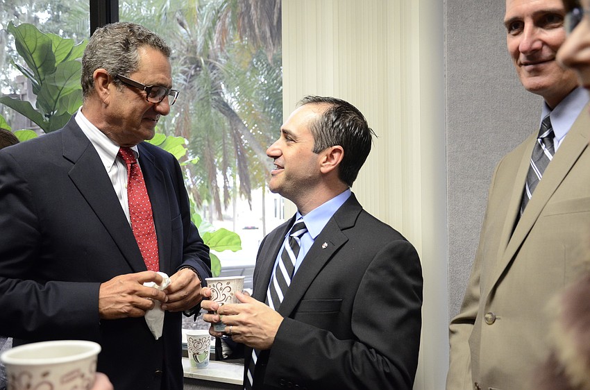 Richard Dorfman and County Commissioner Commissioner Paul Caragiulo.