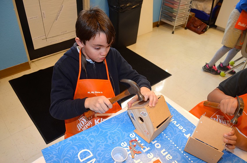 Jack Dibias focuses on his project.