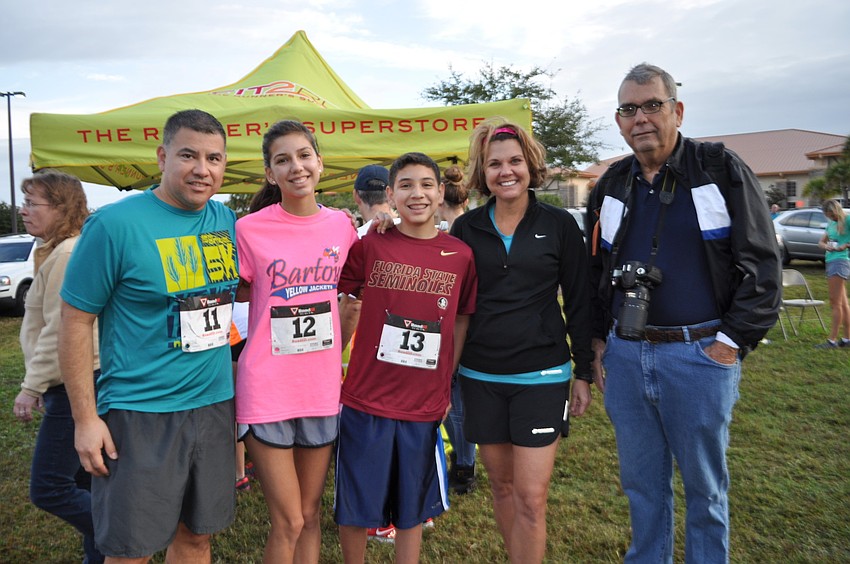 Marco, Bella, Nic and Cheri Avila, of Bartow, visit with Gerry Wilson, of Palmetto.