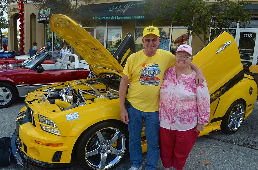 John and Peggy Cornwell sport yellow from clothing to car.