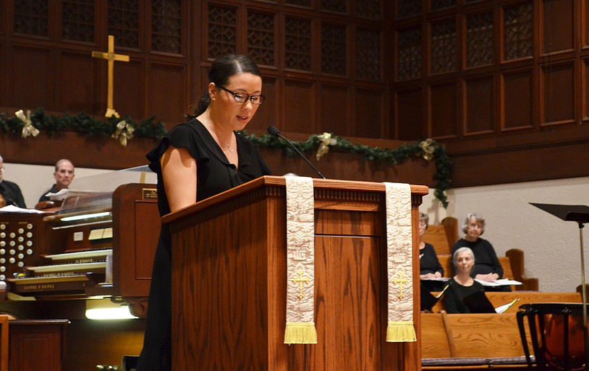 Rev. Melanie Kim speaks during the interfaith service.