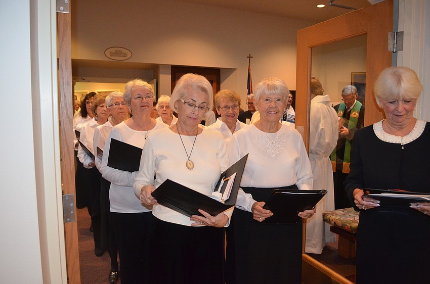 The Interfaith Choir of the Keys begins its procession.