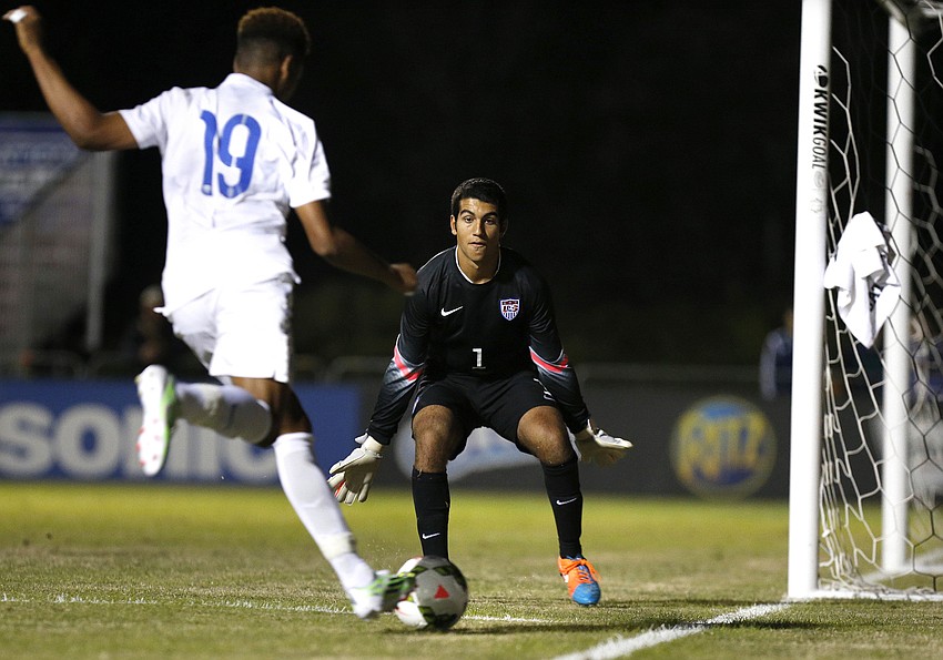 U.S. goalkeeper Kevin Silva defends the goal against Englandâ€™s Jahmal Hector-Ingram in the first half.
