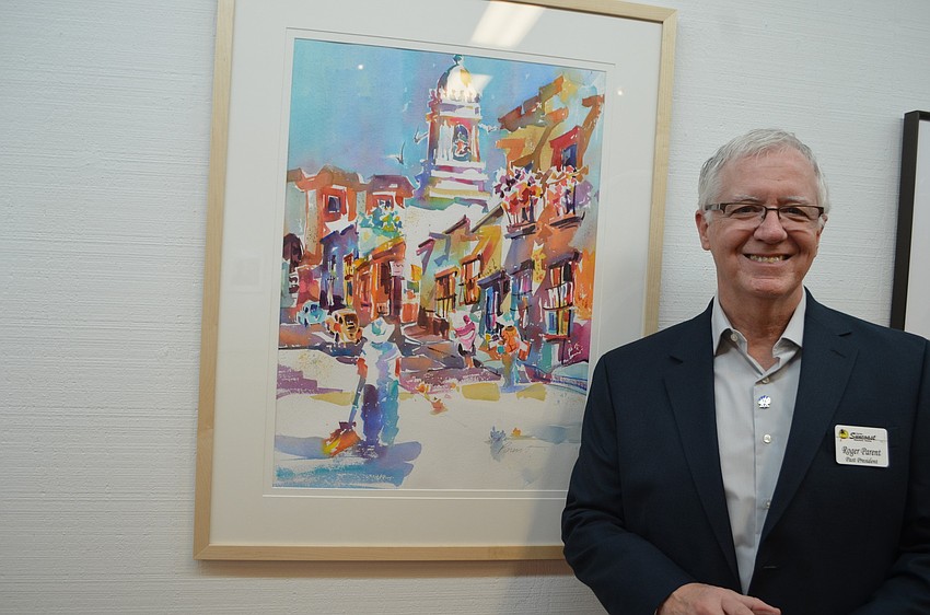 Roger Parent with his painting â€œClean Sweep,â€ a rendering of a street in San Miguel de Allende in Mexico.